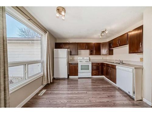 14 Midridge Gardens Se, Calgary, AB - Indoor Photo Showing Kitchen With Double Sink