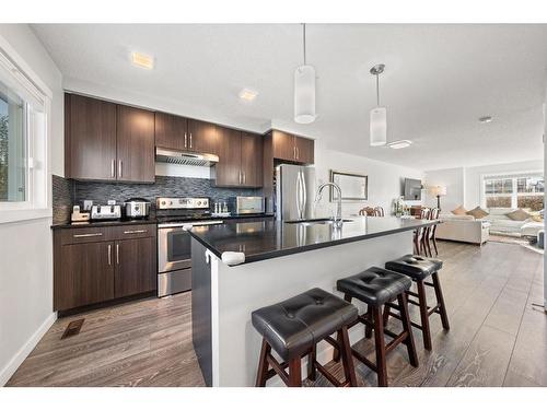 262 Fireside Drive, Cochrane, AB - Indoor Photo Showing Kitchen With Upgraded Kitchen