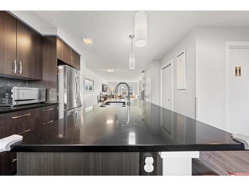 262 Fireside Drive, Cochrane, AB - Indoor Photo Showing Kitchen With Double Sink