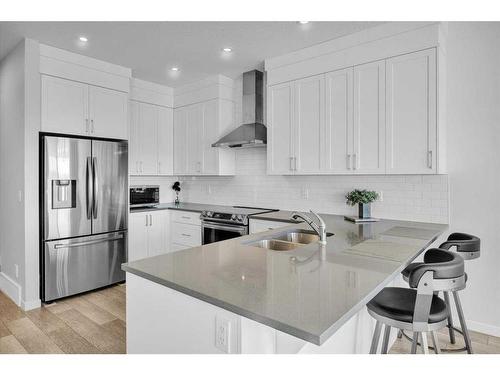 884 Seton Circle Se, Calgary, AB - Indoor Photo Showing Kitchen With Stainless Steel Kitchen With Double Sink With Upgraded Kitchen