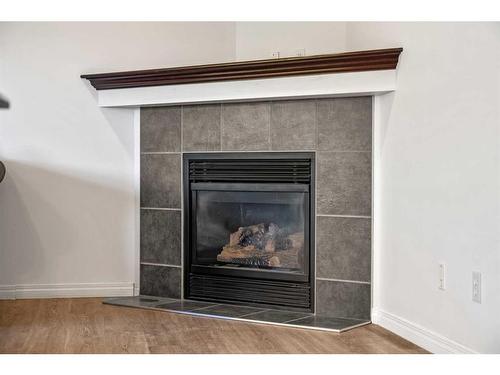 400 Kincora Drive Nw, Calgary, AB - Indoor Photo Showing Living Room With Fireplace