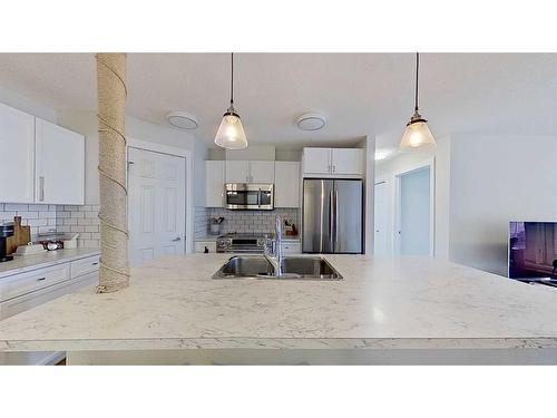 105-2212 34 Avenue Sw, Calgary, AB - Indoor Photo Showing Kitchen With Stainless Steel Kitchen With Upgraded Kitchen