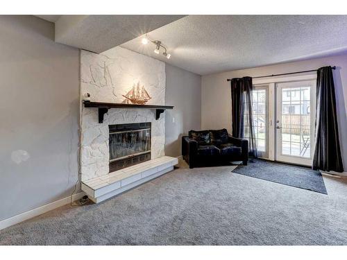 6560 Martingrove Drive Ne, Calgary, AB - Indoor Photo Showing Living Room With Fireplace