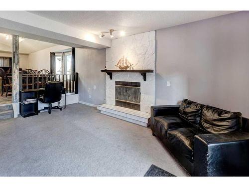 6560 Martingrove Drive Ne, Calgary, AB - Indoor Photo Showing Living Room With Fireplace