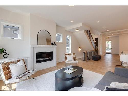 1635 Bowness Road Nw, Calgary, AB - Indoor Photo Showing Living Room With Fireplace