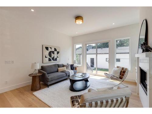 1635 Bowness Road Nw, Calgary, AB - Indoor Photo Showing Living Room With Fireplace