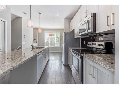 688 Copperpond Boulevard Se, Calgary, AB - Indoor Photo Showing Kitchen With Upgraded Kitchen