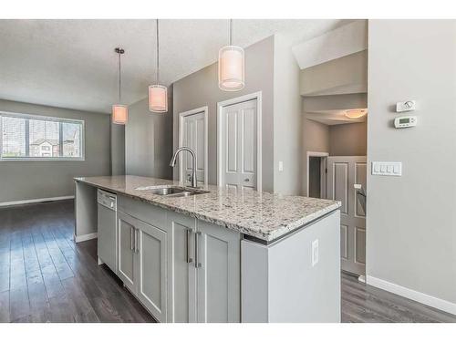 688 Copperpond Boulevard Se, Calgary, AB - Indoor Photo Showing Kitchen With Double Sink With Upgraded Kitchen