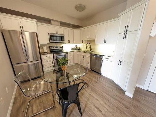 212-1507 Centre A Street Ne, Calgary, AB - Indoor Photo Showing Kitchen With Stainless Steel Kitchen