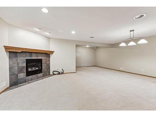 22 West Springs Court Sw, Calgary, AB - Indoor With Fireplace