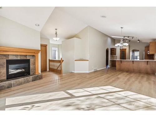 22 West Springs Court Sw, Calgary, AB - Indoor Photo Showing Living Room With Fireplace