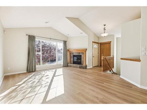 22 West Springs Court Sw, Calgary, AB - Indoor Photo Showing Living Room With Fireplace