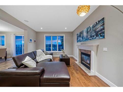 190 Windridge Road Sw, Airdrie, AB - Indoor Photo Showing Living Room With Fireplace