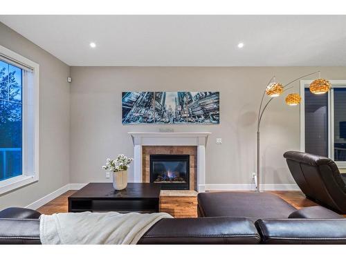 190 Windridge Road Sw, Airdrie, AB - Indoor Photo Showing Living Room With Fireplace