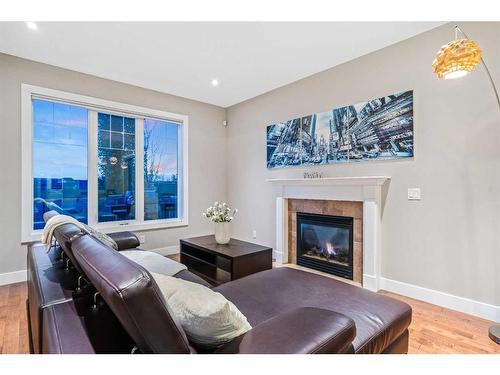 190 Windridge Road Sw, Airdrie, AB - Indoor Photo Showing Living Room With Fireplace