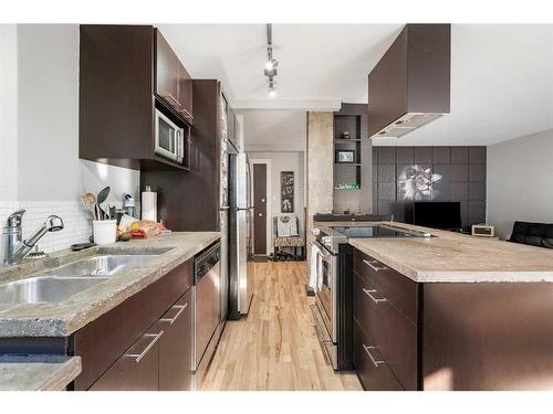 103-2137 16 Street Sw, Calgary, AB - Indoor Photo Showing Kitchen With Double Sink