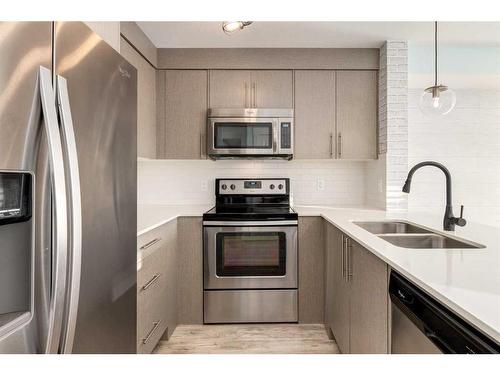 7112-302 Skyview Ranch Drive Ne, Calgary, AB - Indoor Photo Showing Kitchen With Stainless Steel Kitchen With Double Sink With Upgraded Kitchen