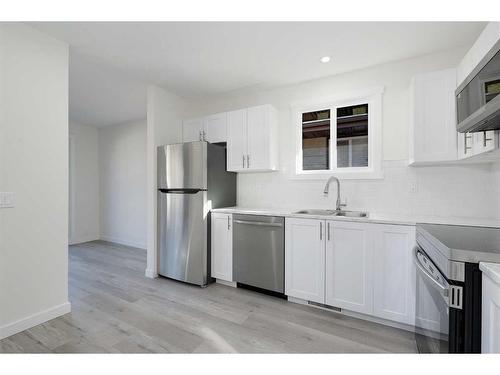 5137 17 Avenue Nw, Calgary, AB - Indoor Photo Showing Kitchen With Stainless Steel Kitchen With Double Sink