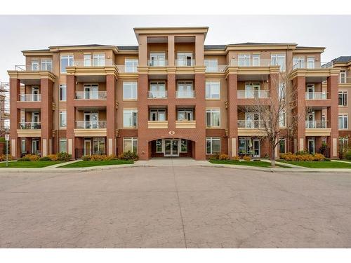 401-4 Hemlock Crescent Sw, Calgary, AB - Outdoor With Balcony With Facade