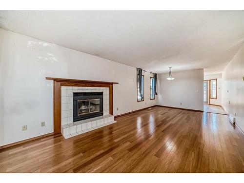 1010 13 Street Se, High River, AB - Indoor Photo Showing Living Room With Fireplace