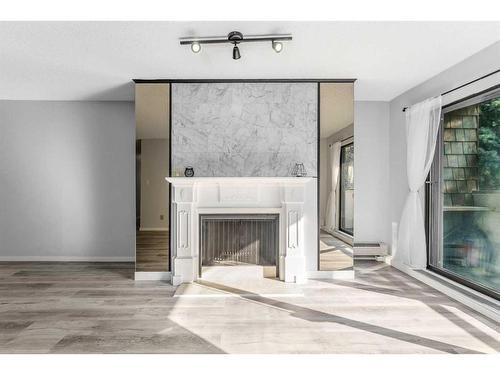 207-3730 50 Street Nw, Calgary, AB - Indoor With Fireplace