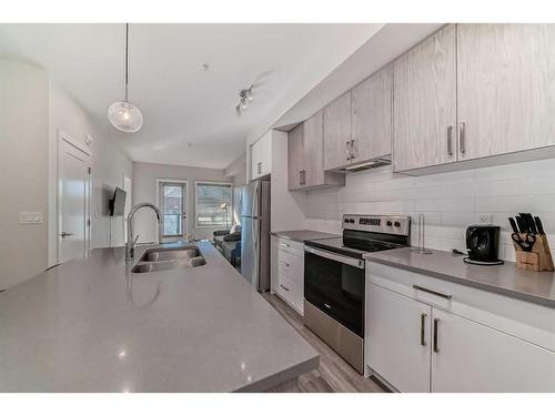 305-138 Sage Valley Common Nw, Calgary, AB - Indoor Photo Showing Kitchen With Double Sink With Upgraded Kitchen