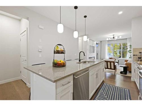 153 Burma Star Road Sw, Calgary, AB - Indoor Photo Showing Kitchen With Double Sink With Upgraded Kitchen