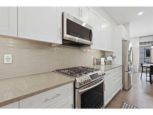 153 Burma Star Road Sw, Calgary, AB - Indoor Photo Showing Kitchen With Stainless Steel Kitchen With Upgraded Kitchen