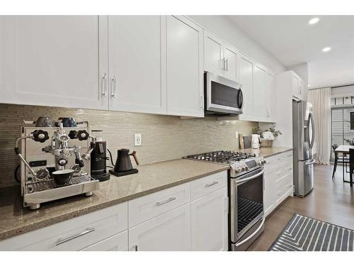 153 Burma Star Road Sw, Calgary, AB - Indoor Photo Showing Kitchen With Stainless Steel Kitchen With Upgraded Kitchen