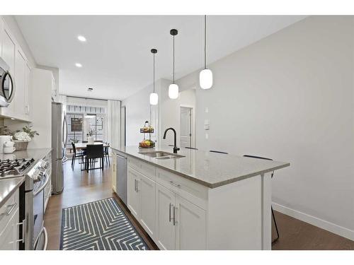 153 Burma Star Road Sw, Calgary, AB - Indoor Photo Showing Kitchen With Double Sink With Upgraded Kitchen