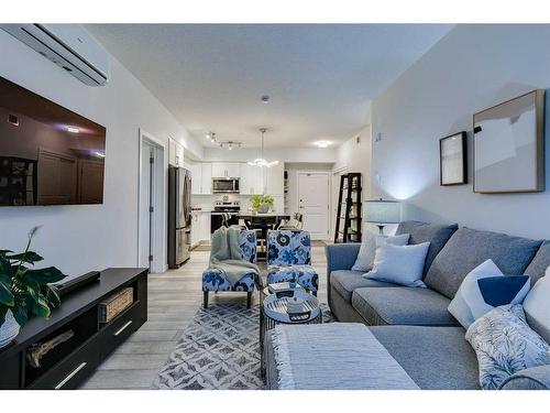 3208-3727 Sage Hill Drive Nw, Calgary, AB - Indoor Photo Showing Living Room