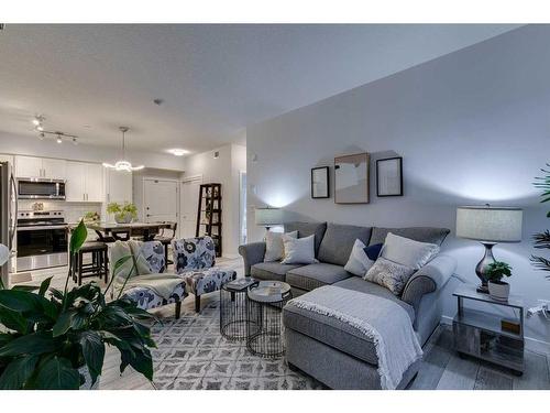 3208-3727 Sage Hill Drive Nw, Calgary, AB - Indoor Photo Showing Living Room