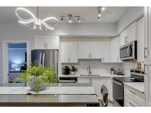 3208-3727 Sage Hill Drive Nw, Calgary, AB - Indoor Photo Showing Kitchen With Double Sink With Upgraded Kitchen