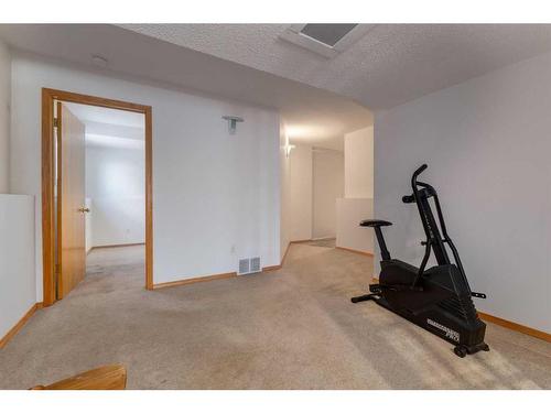 220 Hawksbrow Drive, Calgary, AB - Indoor Photo Showing Gym Room