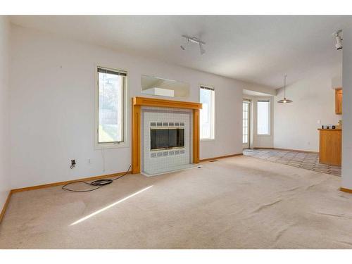 220 Hawksbrow Drive, Calgary, AB - Indoor Photo Showing Other Room With Fireplace