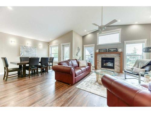 176 Cove Crescent, Chestermere, AB - Indoor Photo Showing Living Room With Fireplace