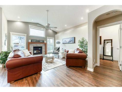 176 Cove Crescent, Chestermere, AB - Indoor Photo Showing Living Room With Fireplace