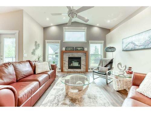 176 Cove Crescent, Chestermere, AB - Indoor Photo Showing Living Room With Fireplace