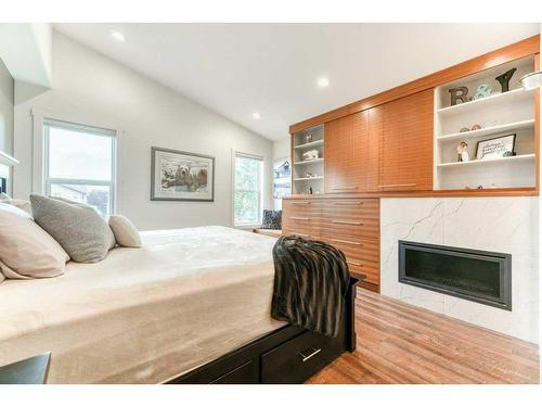 176 Cove Crescent, Chestermere, AB - Indoor Photo Showing Bedroom With Fireplace