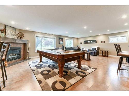 176 Cove Crescent, Chestermere, AB - Indoor Photo Showing Other Room With Fireplace