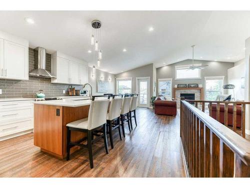 176 Cove Crescent, Chestermere, AB - Indoor Photo Showing Kitchen With Fireplace With Upgraded Kitchen