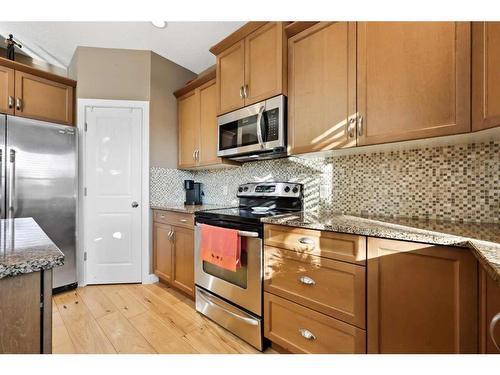 346 Fireside Place, Cochrane, AB - Indoor Photo Showing Kitchen With Stainless Steel Kitchen