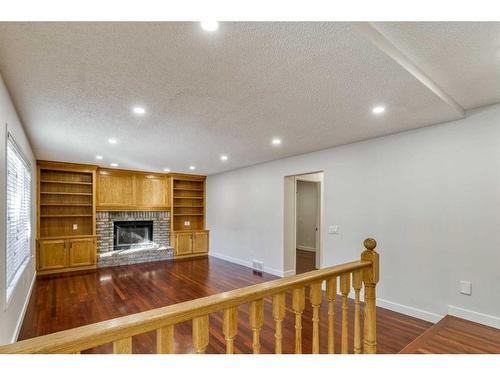 215 Hawkstone Close Nw, Calgary, AB - Indoor With Fireplace