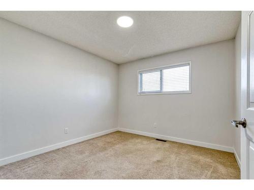 215 Hawkstone Close Nw, Calgary, AB - Indoor Photo Showing Other Room