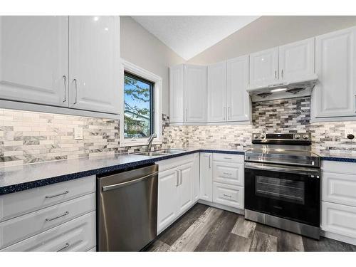 100 Ranch Estates Drive Nw, Calgary, AB - Indoor Photo Showing Kitchen With Double Sink With Upgraded Kitchen