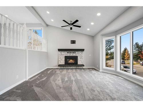 100 Ranch Estates Drive Nw, Calgary, AB - Indoor Photo Showing Living Room With Fireplace