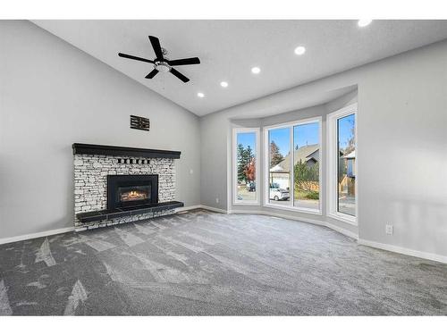 100 Ranch Estates Drive Nw, Calgary, AB - Indoor Photo Showing Living Room With Fireplace