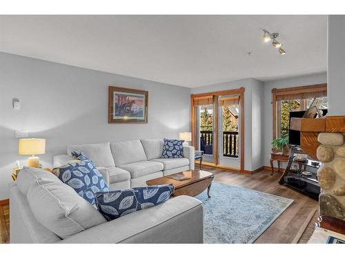 202-150 Crossbow Place, Canmore, AB - Indoor Photo Showing Living Room