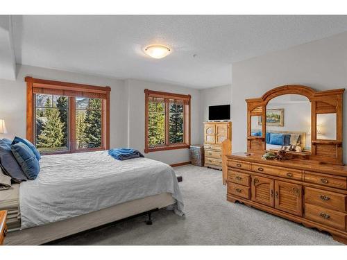 202-150 Crossbow Place, Canmore, AB - Indoor Photo Showing Bedroom