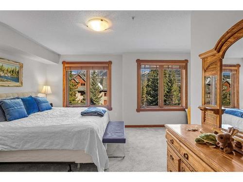 202-150 Crossbow Place, Canmore, AB - Indoor Photo Showing Bedroom